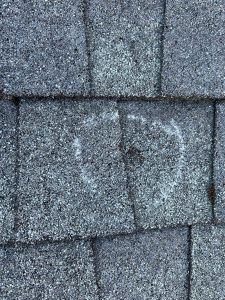 results of hail storm damage on a roof