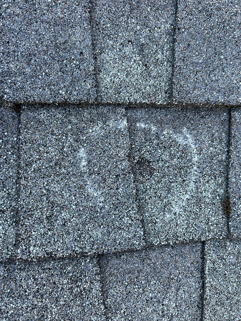 results of hail storm damage on a roof