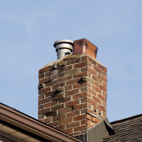 brick-chimney-on-a-house-roof-against-sky-2026-03-26-07-37-45-utc